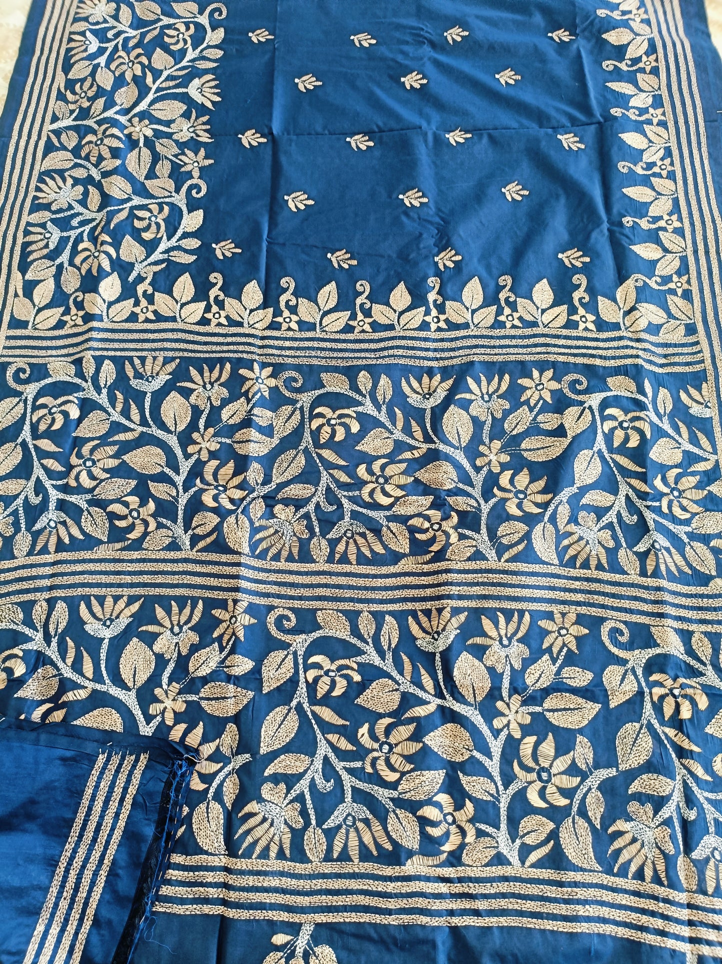 Blue fabric with gold floral patterns
