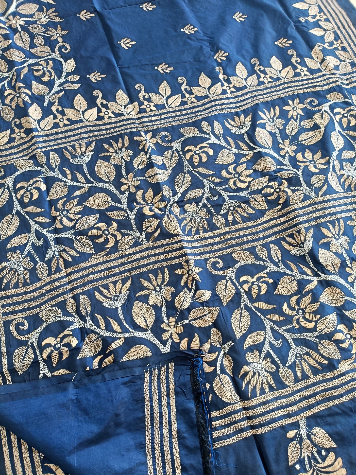 Blue fabric with gold floral patterns