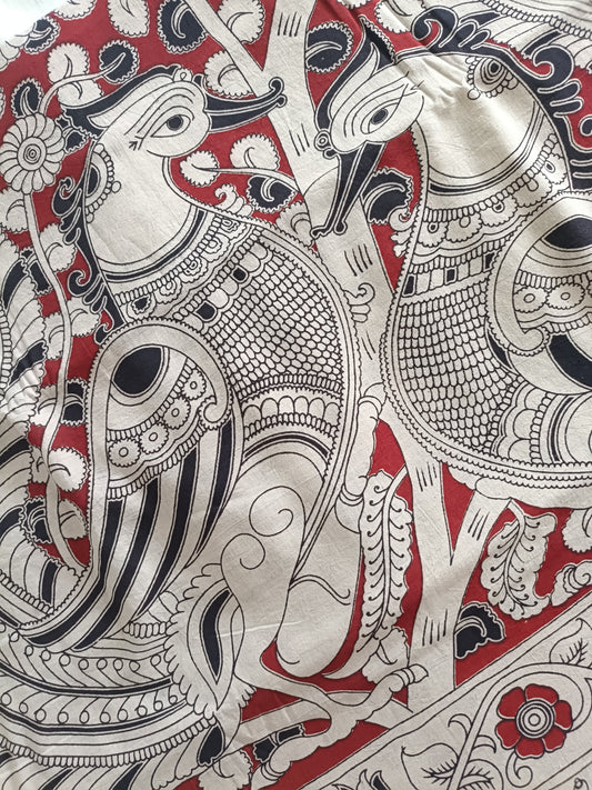 Hand-drawn Kalamkari blouse fabric with natural dyes and peacock motifs