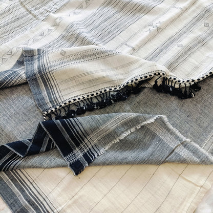 Textile with geometric pattern on a wooden surface