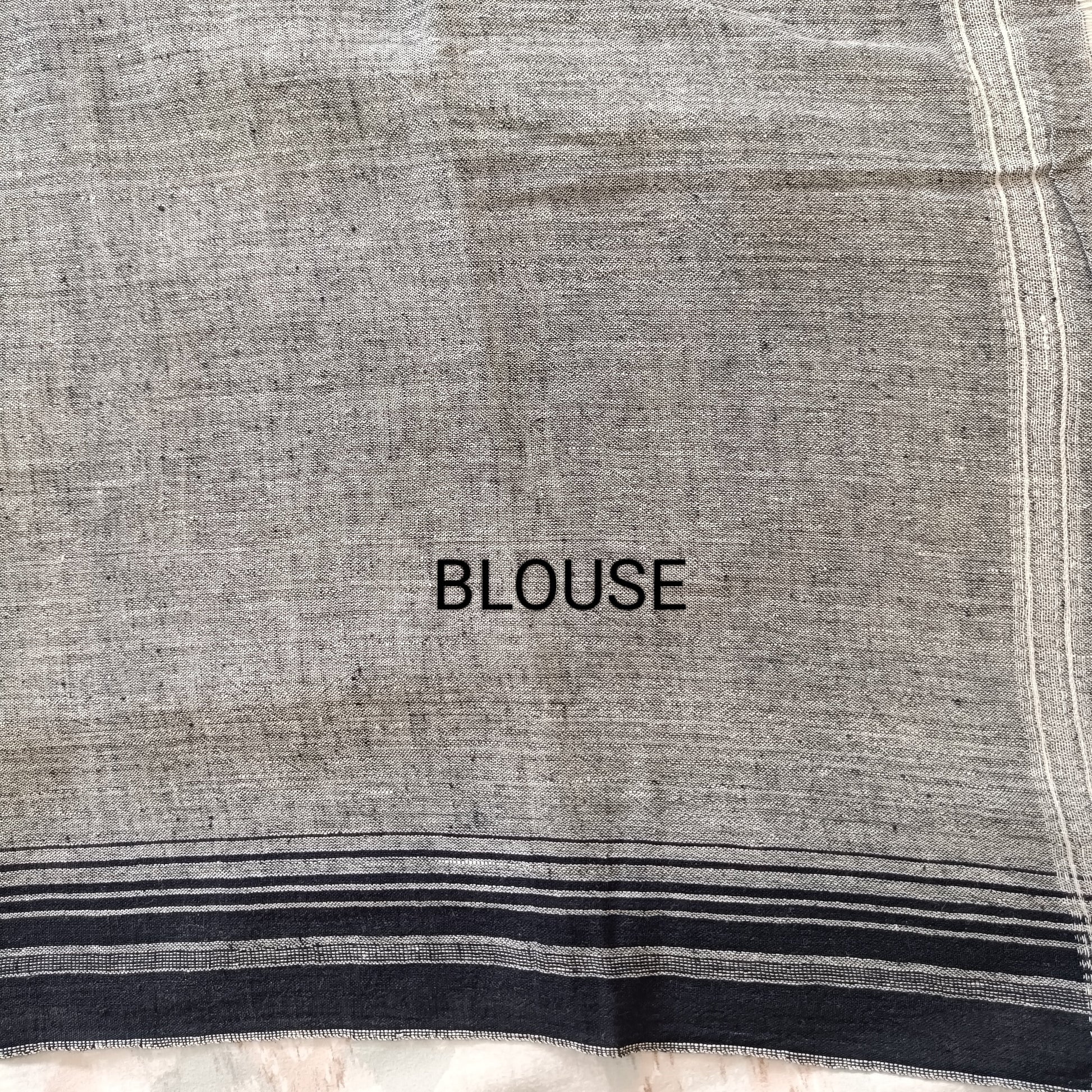 Text 'BLOUSE' on a fabric background with black and white stripes.