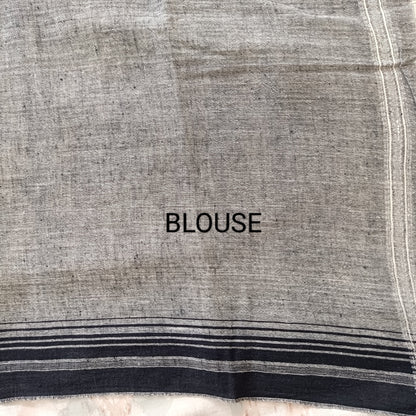Text 'BLOUSE' on a fabric background with black and white stripes.
