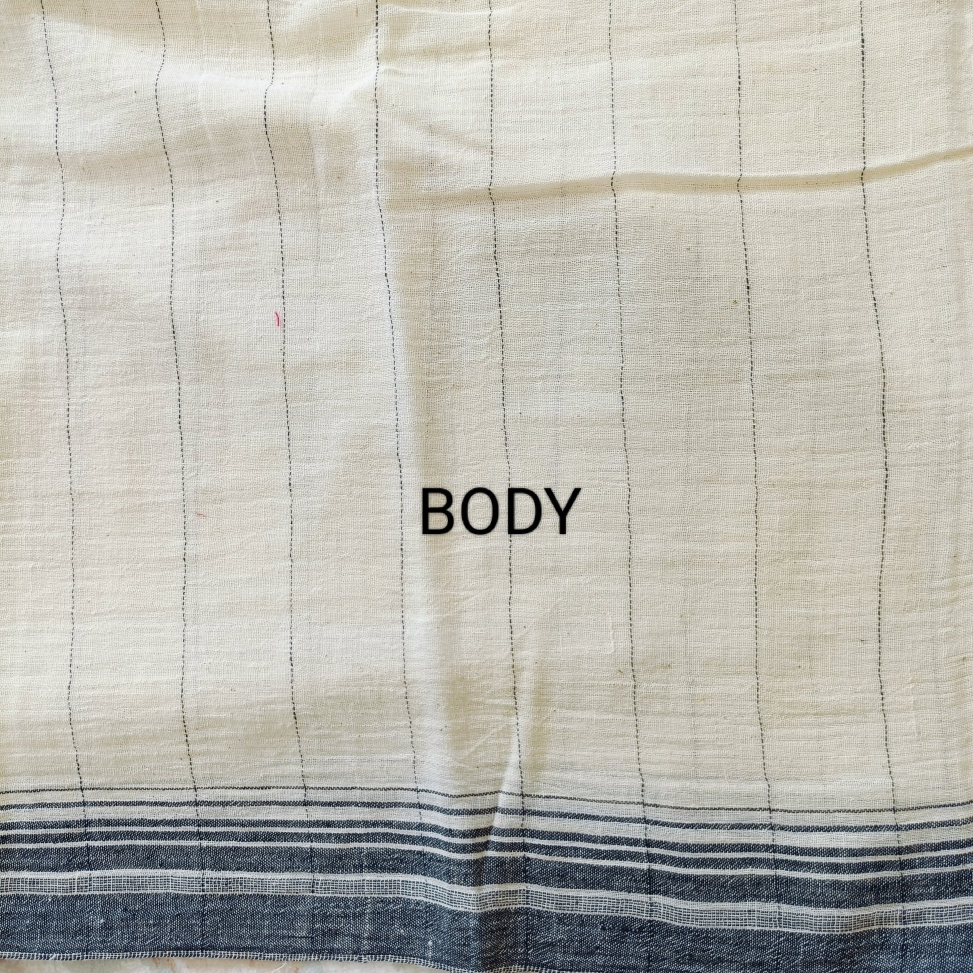Textile fabric with 'BODY' label on a checkered pattern