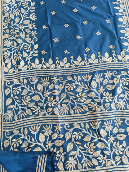 Blue fabric with intricate white floral patterns