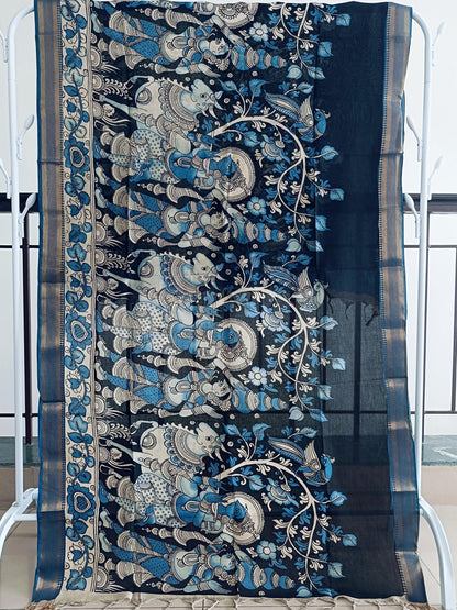 Decorative blue and silver fabric with intricate patterns on a chair.