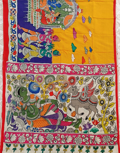 Colorful tapestry with intricate designs of elephants and other elements on a yellow background.