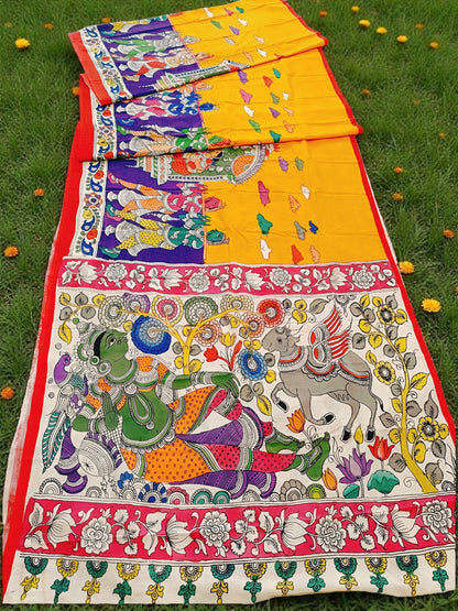 Colorful traditional fabric with intricate designs on a grassy background