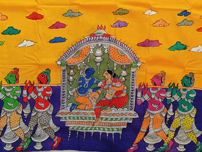 Colorful traditional fabric with a scene of people and architecture on a yellow and blue background.