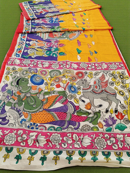 Colorful traditional fabric with intricate designs on a green background